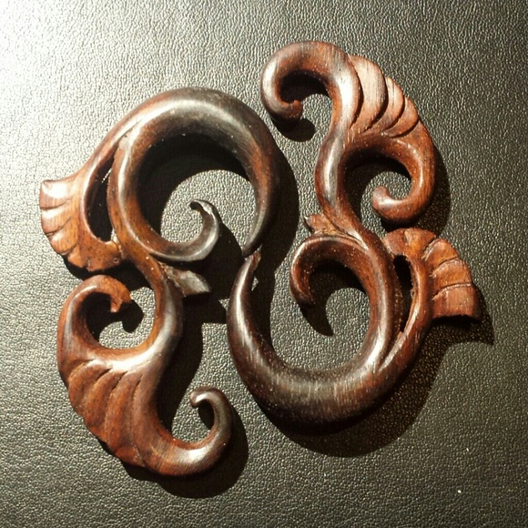 *Reserved for tiny* hand carved wood gauges.