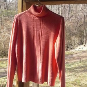 Gorgeous melon color sweater with ribbing on the f