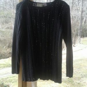 Gorgeous knit sweater very feminine but has the