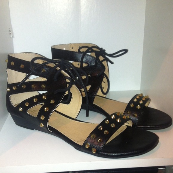 Black sandals with gold stubs
