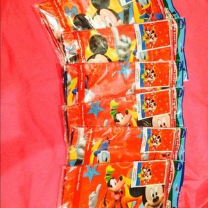 4 Mickey Mouse table cloths and 2 green polka dots