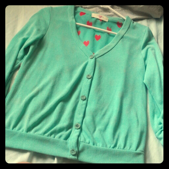 Mint colored cardigan with red hearts on the back