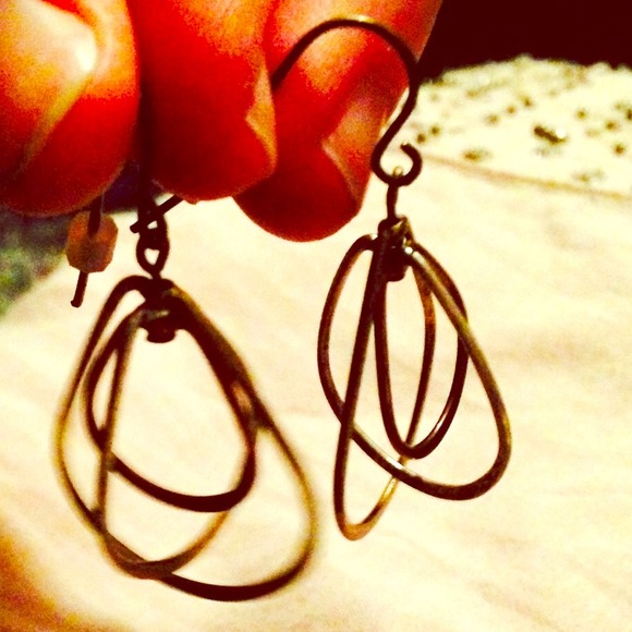 Brass dangle earrings.