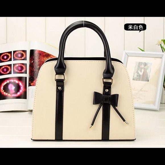 no Handbags - designer hand bag.  Cream/ black