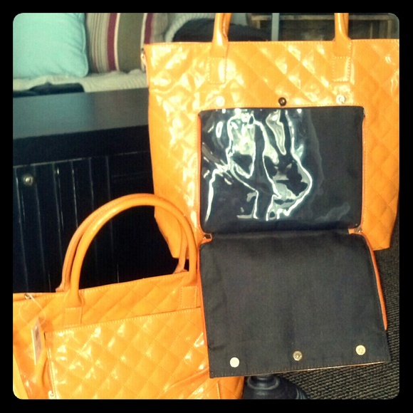 orange purse and tablet bag