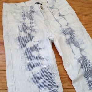 White jeans with navy vertical stripes going down