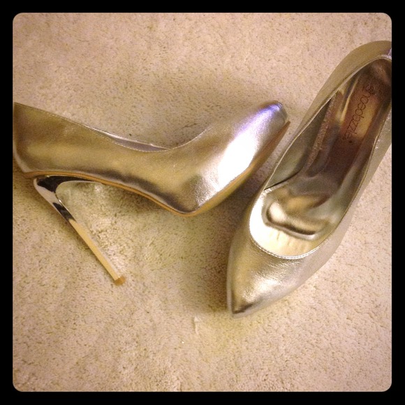 SOLD.  Brand new size 7.5 silver heels