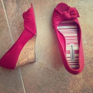 A pair of heels with a small wedge and bow