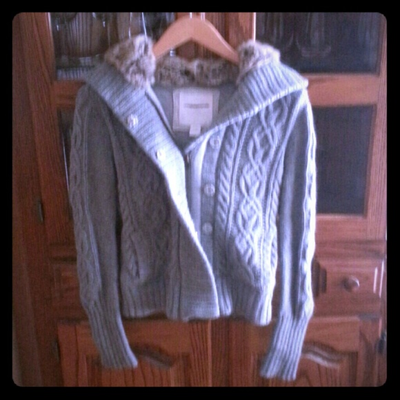 Zip up hooded sweater.