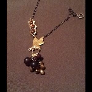 Necklace with burgundy beads.