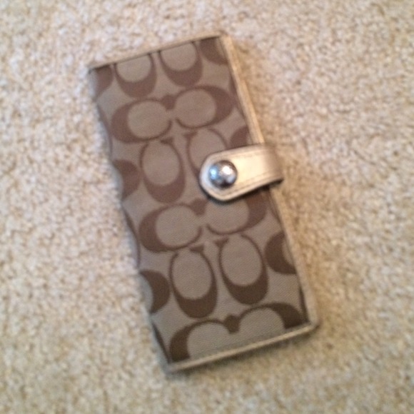 Coach wallet/checkbook with gold leather trim.