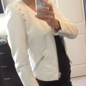 Faux white leather jacket.