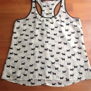 Silky racer back top with ruffles.