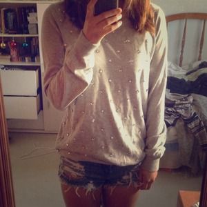 grey sweater with crystals on the front