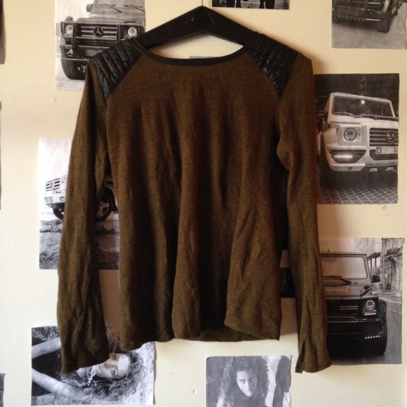 green sweater with leather shoulders