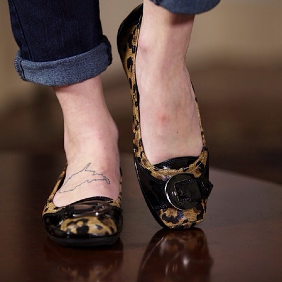 Leopard print flats with buckle.
