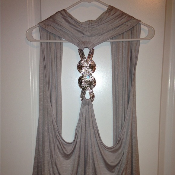 Grey vest, silver back detail.