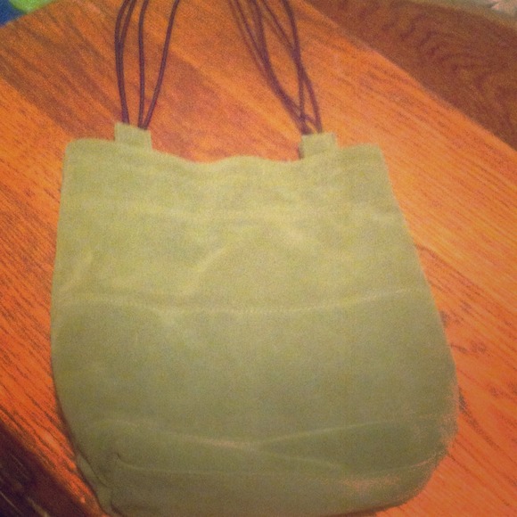 Green suede drawstring bag.