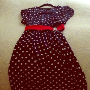 Polka dot print dress with red waisted belt.