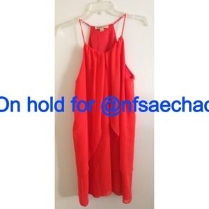 Bright orange mini dress. Very flowy. Never worn