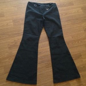 Bell bottom stripped black and silver pants.