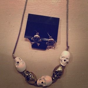 Skull necklace with matching ear rings.