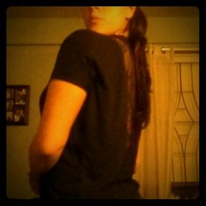 Black shirt with lace detail.