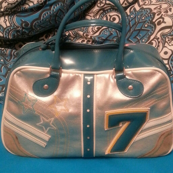 blue and silver with 7 letter and stars satchels