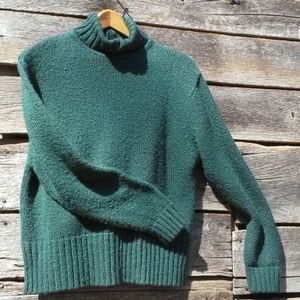 Intricately knitted emerald green turtleneck light