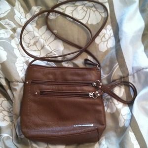 Brown leather cross body bag with zippers