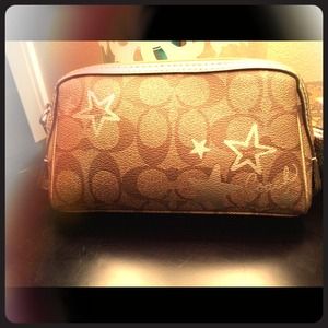 Small Coach makeup bag