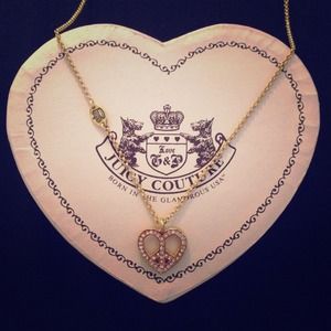 Juicy Couture gold peace heart necklace!