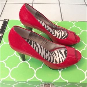 Red peep toe pump heels