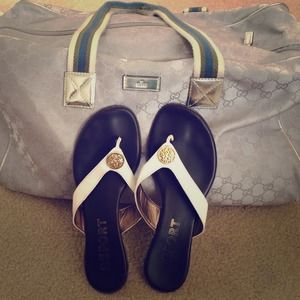 White flip flops with gold trim