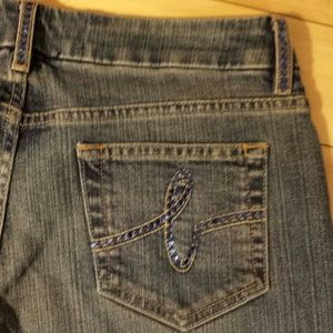 Reduced**Bebe jeans with purple rhinestones