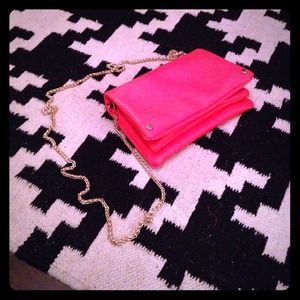 Neon orange cross body bag.