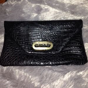 Jimmy choo envelope ,black snakeskin, never worn.