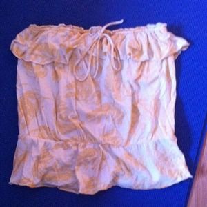 Sleeveless tank. Flair on top and bottom