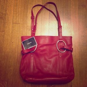 Red leather handbag.
