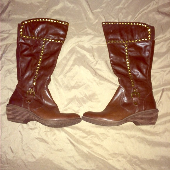 Brown studded boots.