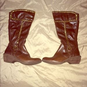 Brown studded boots.