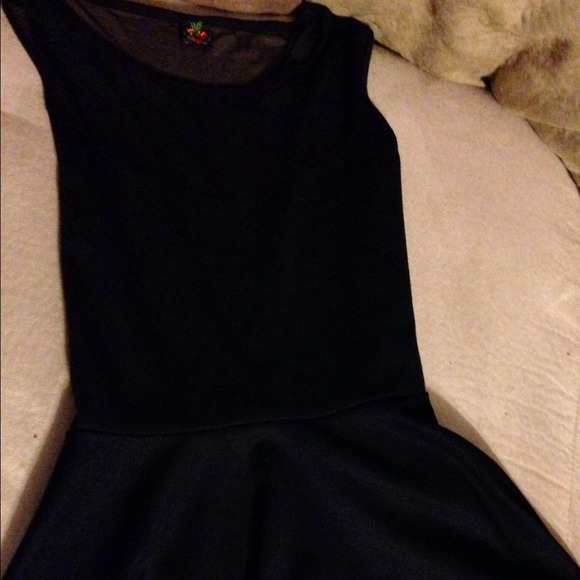 Chic peplum top with sheer chest paneling!