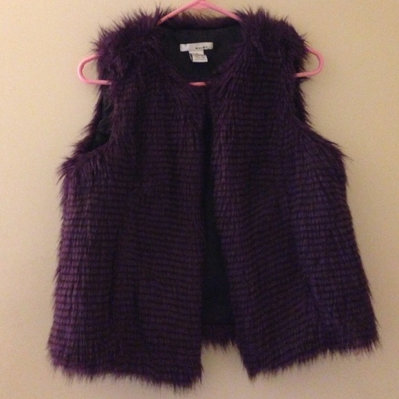 Faux fur eggplant color vest,never worn. No trade