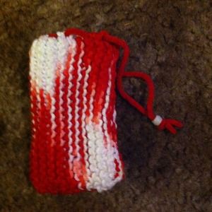 Small hand knitted cinch bag