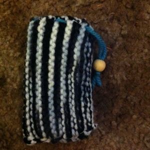 Small hand knitted cinch bag