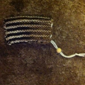 Small hand knitted cinch bag