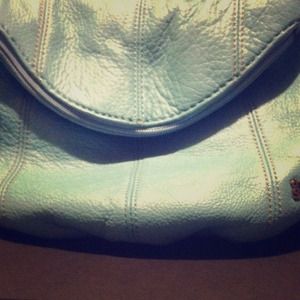 The Sak a purse, outside is leather, inside isn't