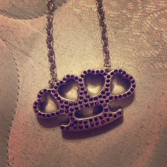 Purple jeweled brass knuckle necklace