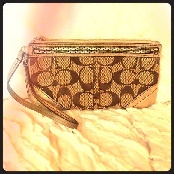 Coach wristlet with metallic accents and beading