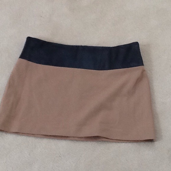 Sexy mini with "leather" band at waist.